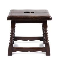A Jacobean Style Walnut Stool Height 17 x width 17 1/2 x depth 14 inches.