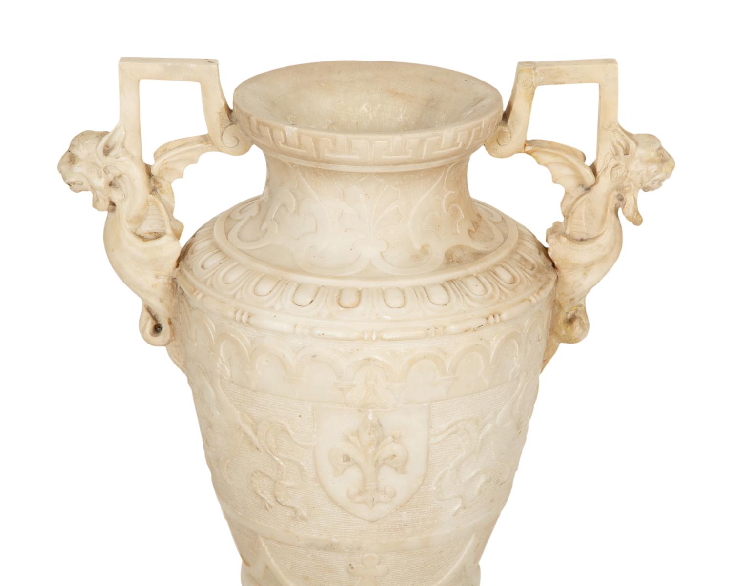 An Italian Carved Marble Urn with Griffin Handles