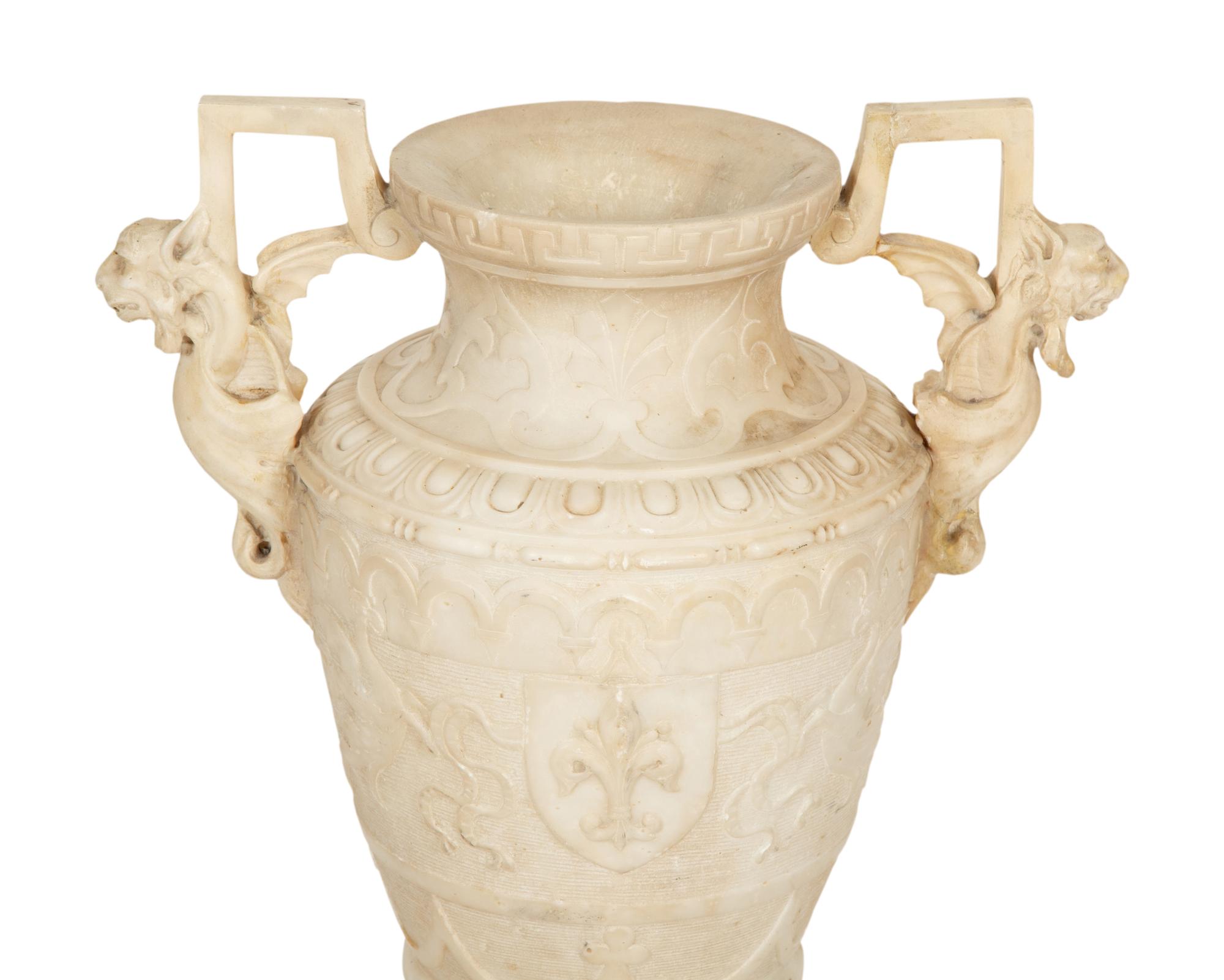 An Italian Carved Marble Urn with Griffin Handles
