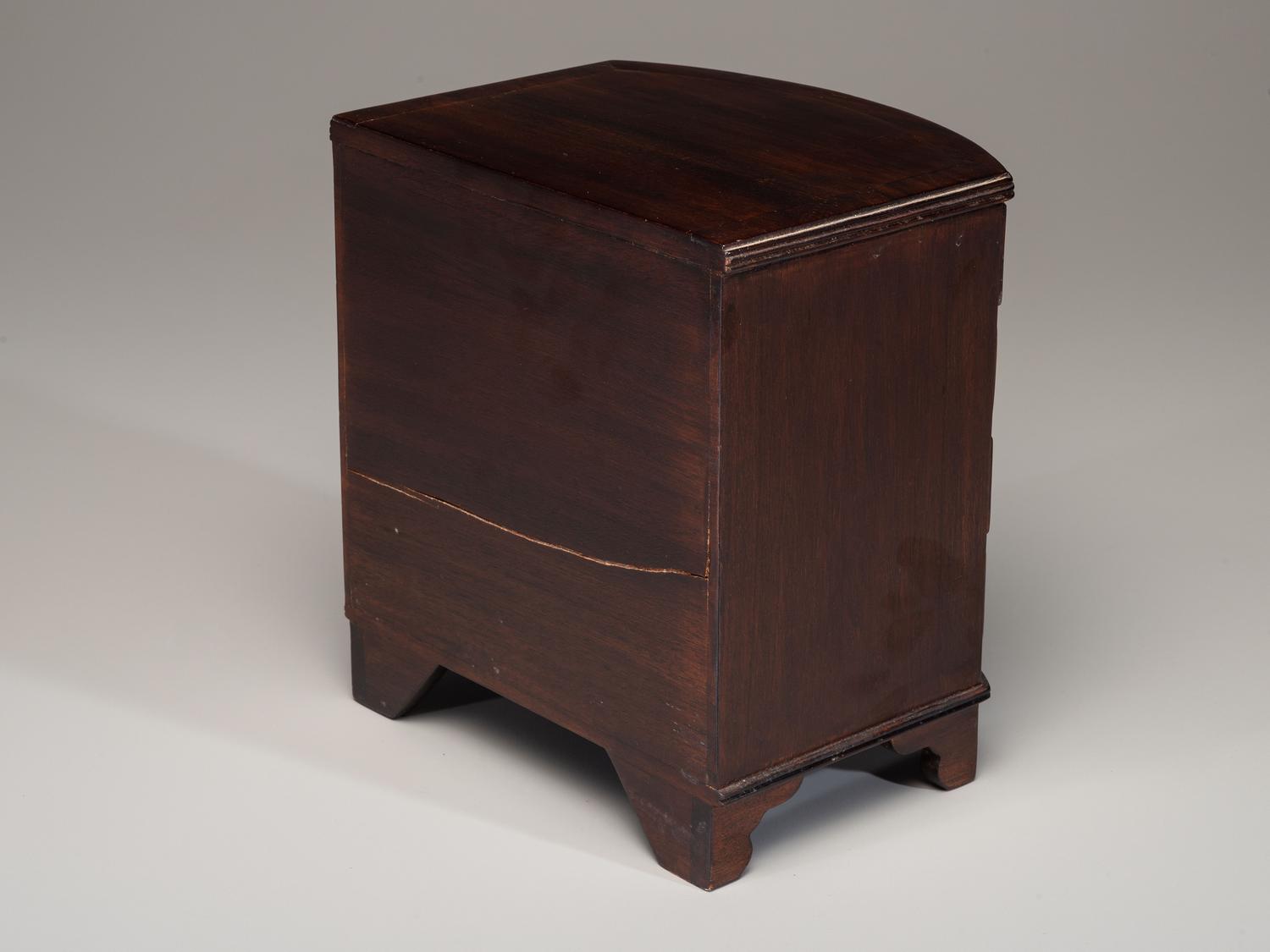 A Miniature Bow Front Chest of Drawers and Drop-Leaf Dining Table