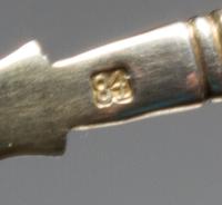 A Russian Enameled Silver and Plique-a-Jour Tea Scoop, , having a polychrome enamel and twist decorated handle, the scoop surrounded wi