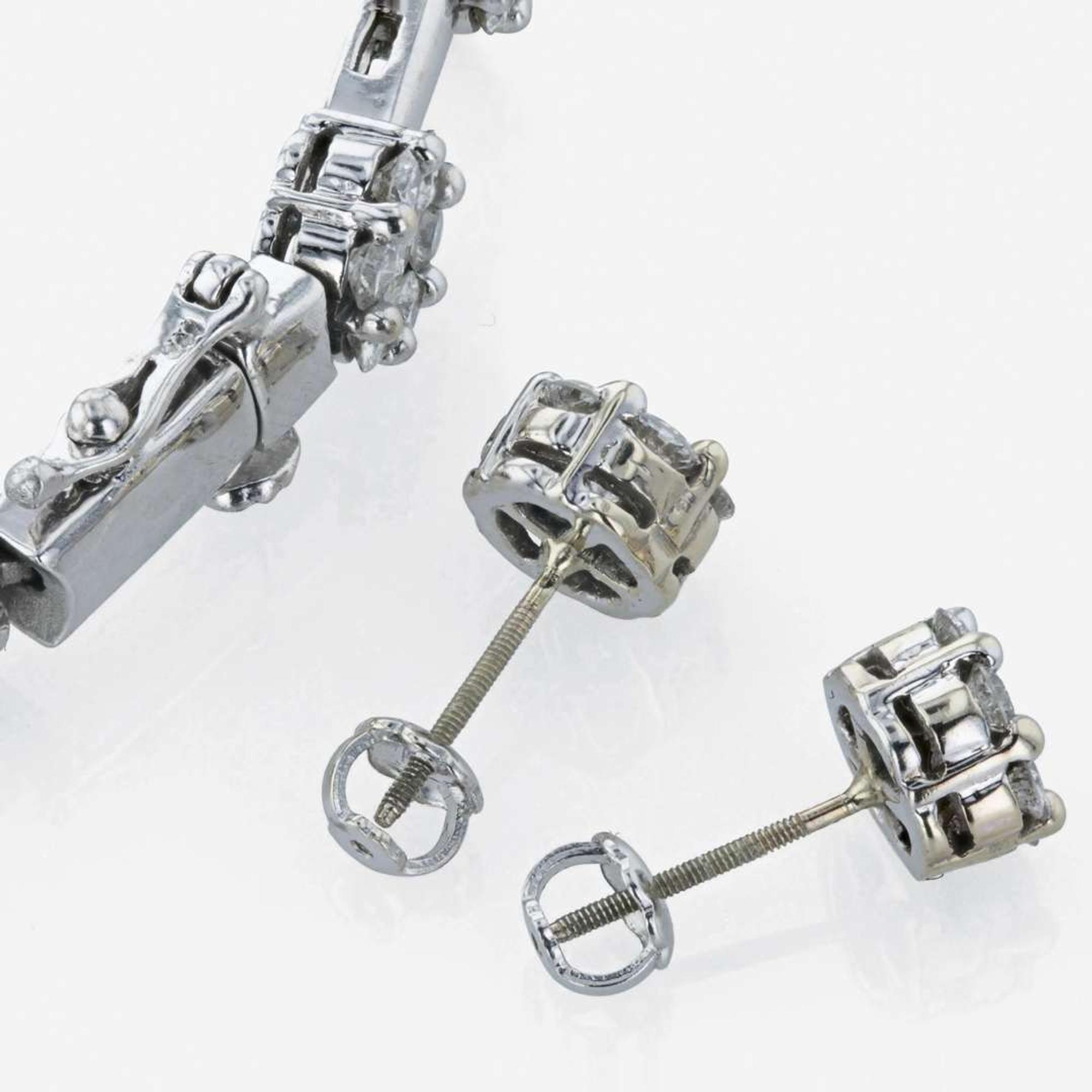 A diamond bracelet and matching diamond stud earrings
