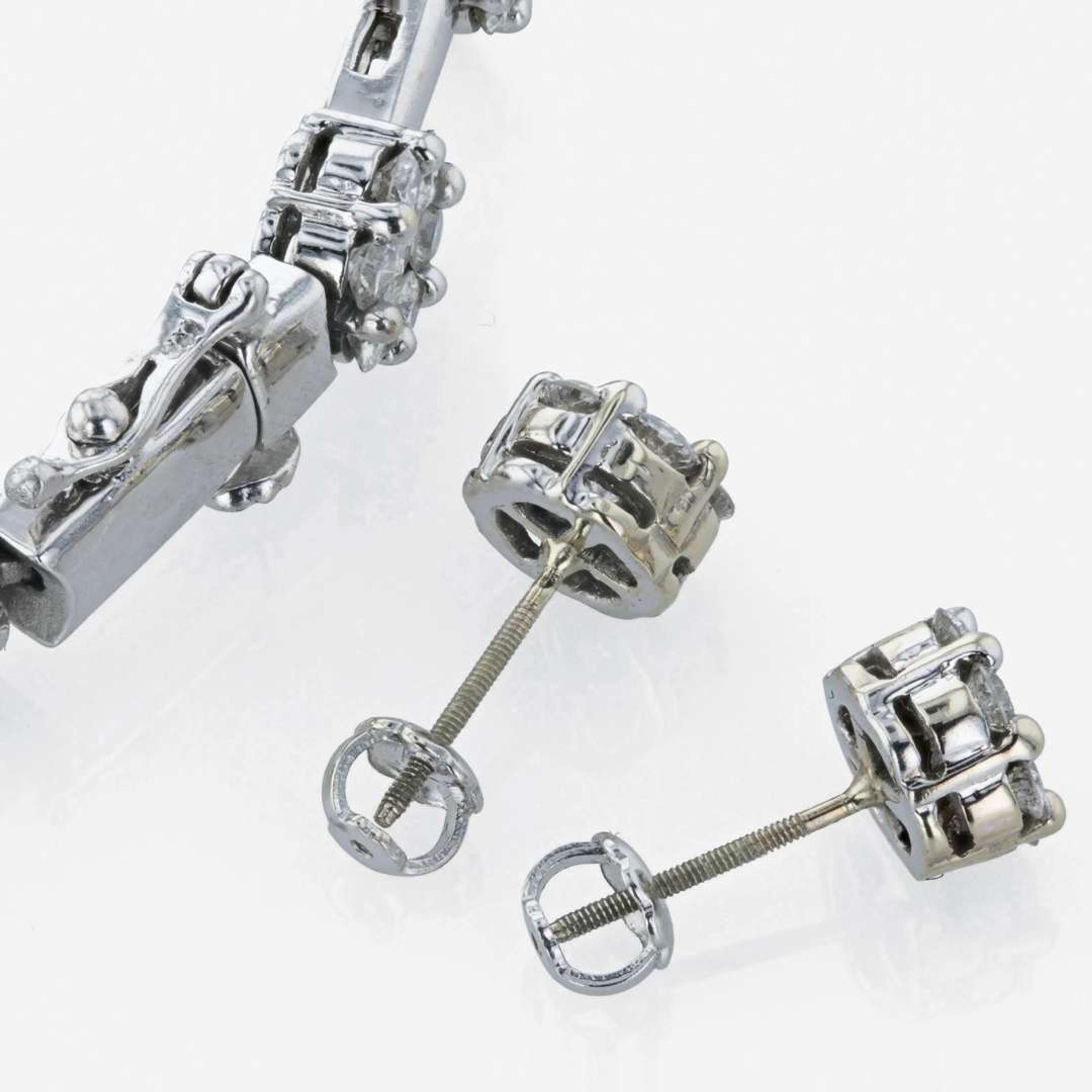 A diamond bracelet and matching diamond stud earrings