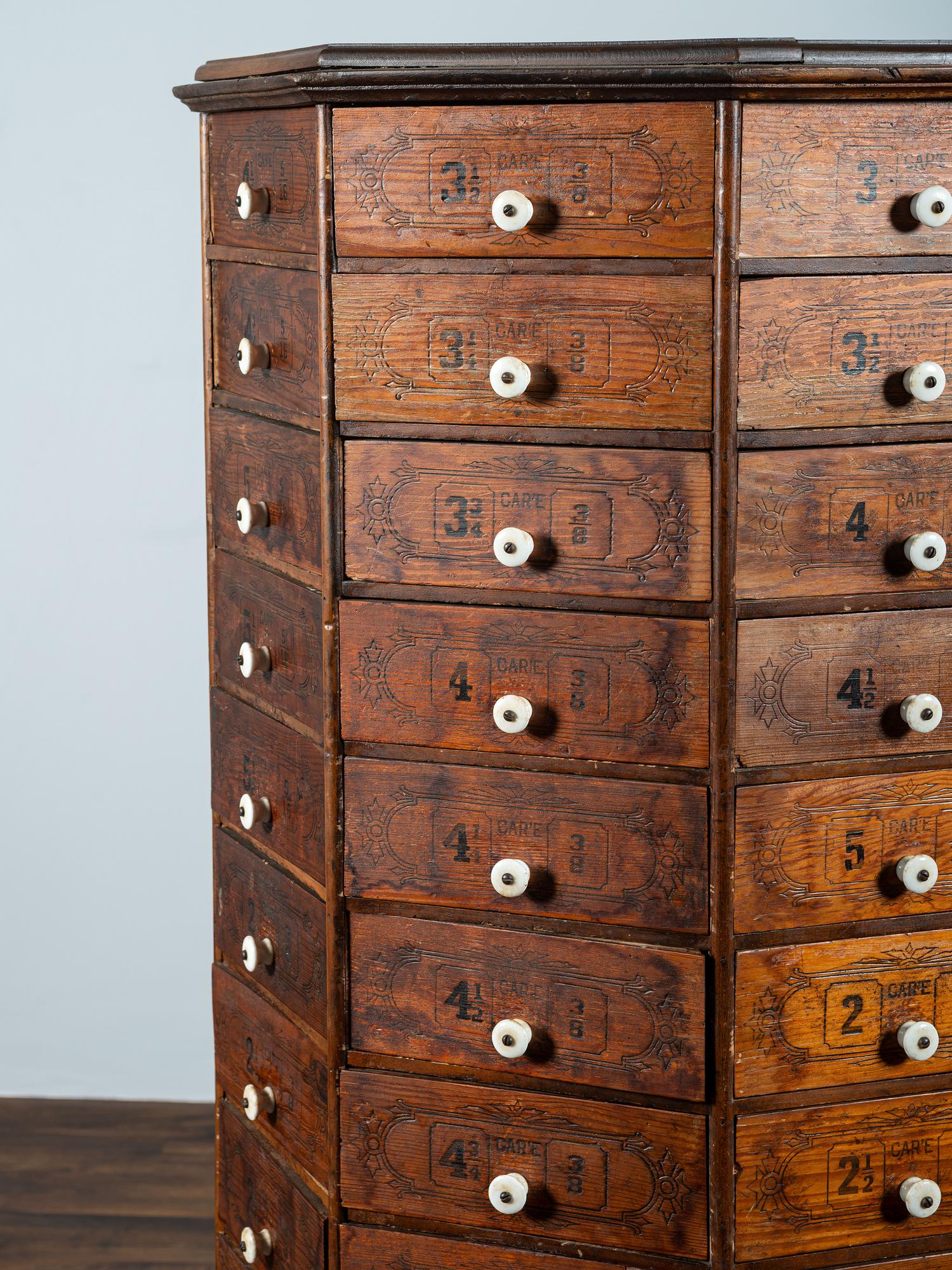 An American Bolt and Screw Case Company Stenciled Pine Octagonal Rotating Cabinet