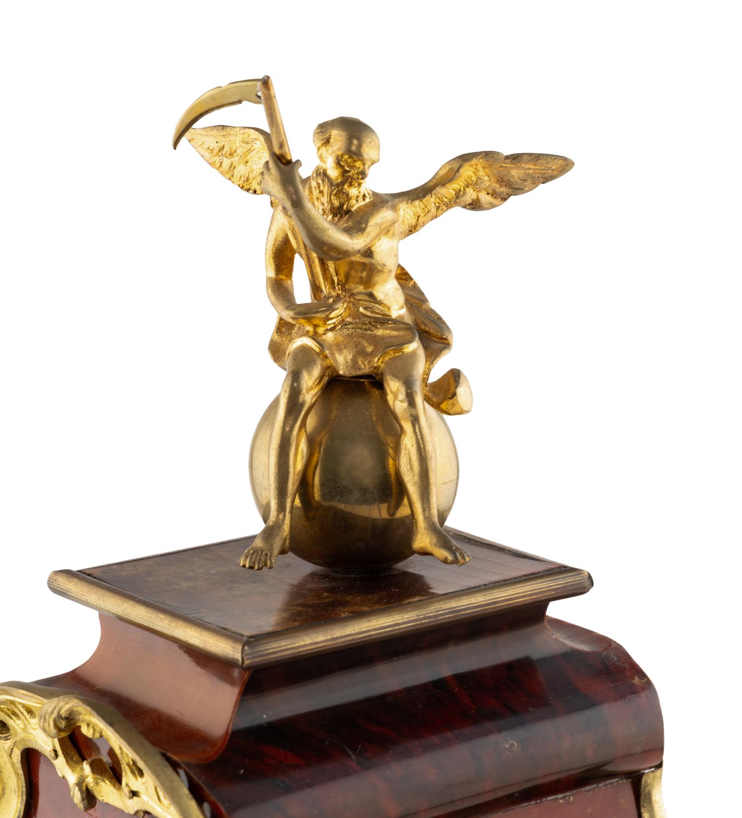A Louis XV Style Gilt Metal and Faux Tortoise Shell Mantel Clock