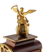 A Louis XV Style Gilt Metal and Faux Tortoise Shell Mantel Clock