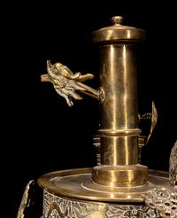 A Tibetan Silver and Copper Covered Ewer and A Chinese Bronze Pitcher