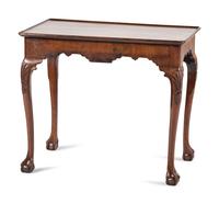 A Queen Anne Shell-Carved and Veneered Walnut Dish-Top Claw-and-Ball Foot Tea Table