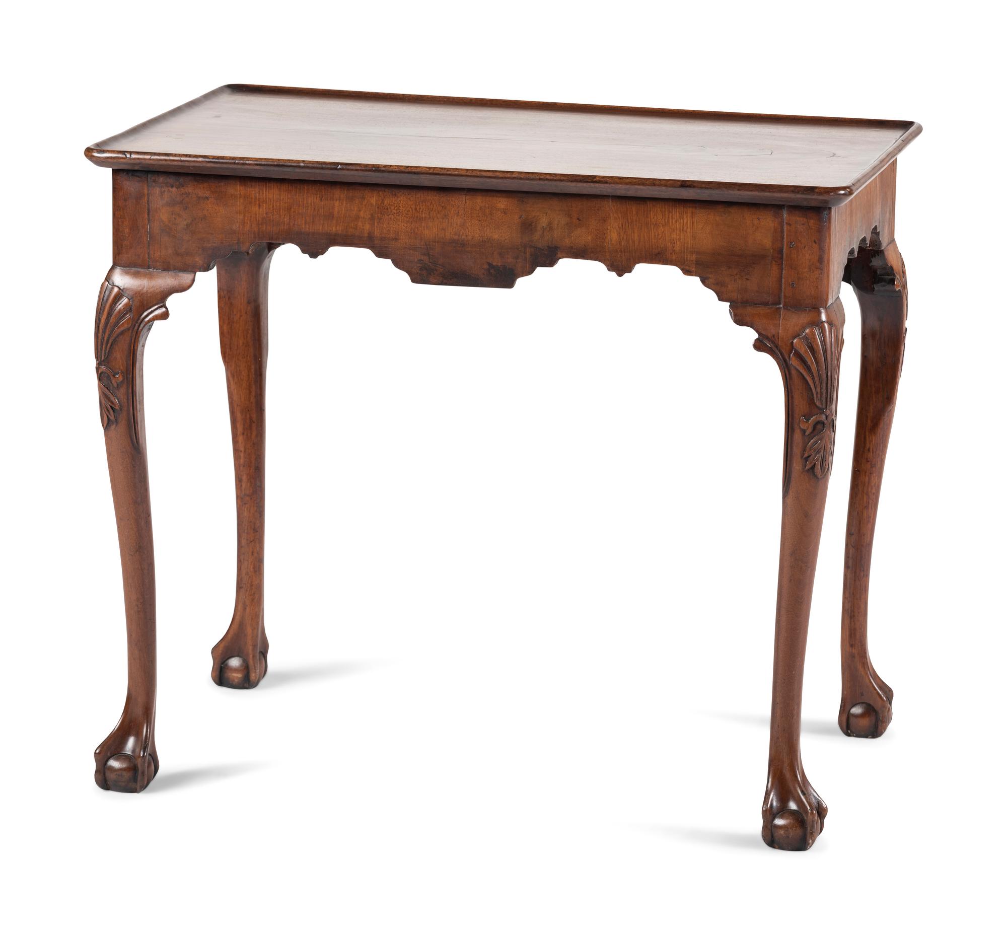 A Queen Anne Shell-Carved and Veneered Walnut Dish-Top Claw-and-Ball Foot Tea Table