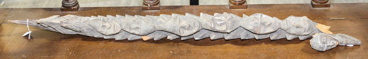 A Sepik River Carved House Post, Papua, New Guinea Height 53 1/4 x width 4 x depth 4 1/2 inches.