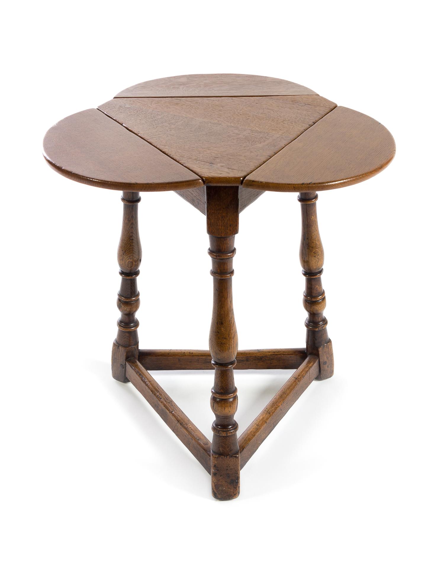 A Jacobean Style Oak Drop-Leaf Table Height 22 inches. — 20TH CENTURY