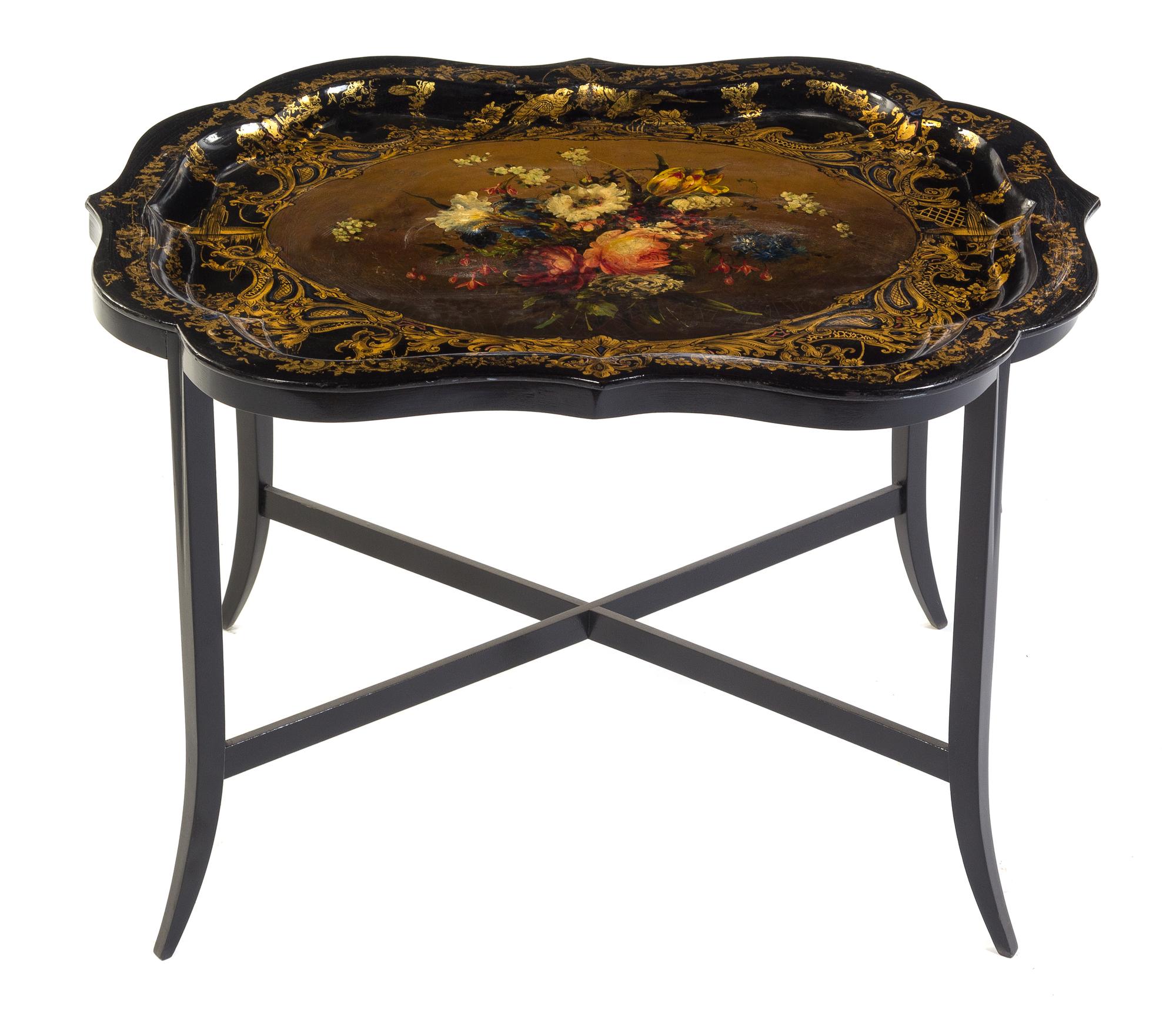 A Victorian Black Lacquered, Gilt and Polychrome Painted Papier Mache Tray on Stand Width of tray 31 inches. — 19TH CENTURY