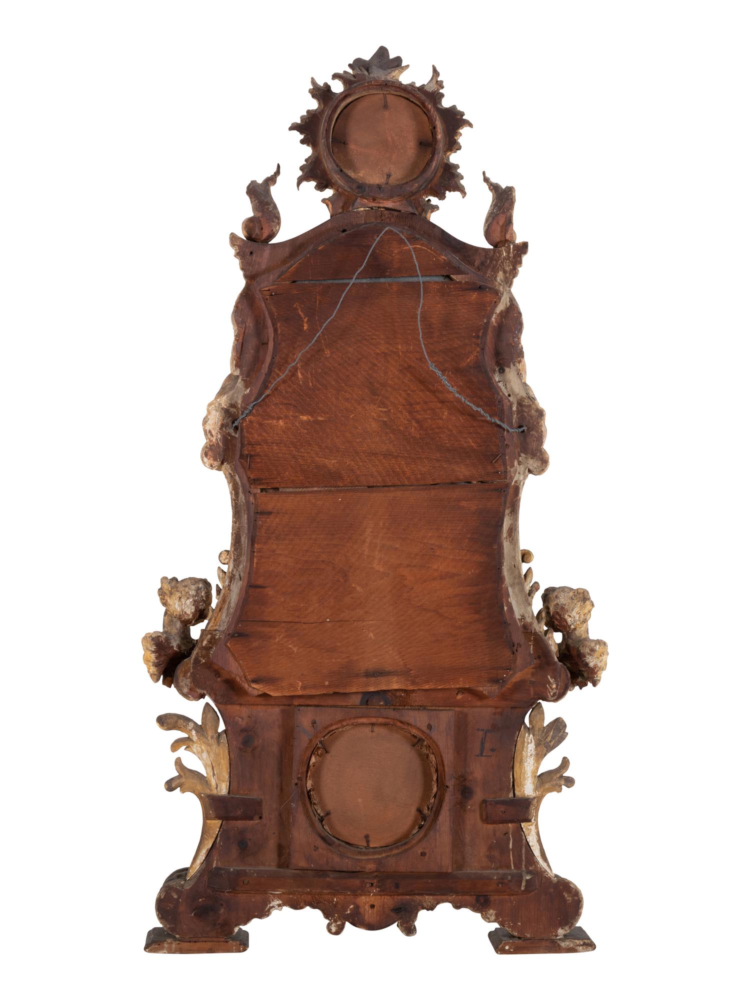 An Italian Rococo Figural Carved Giltwood Mirror