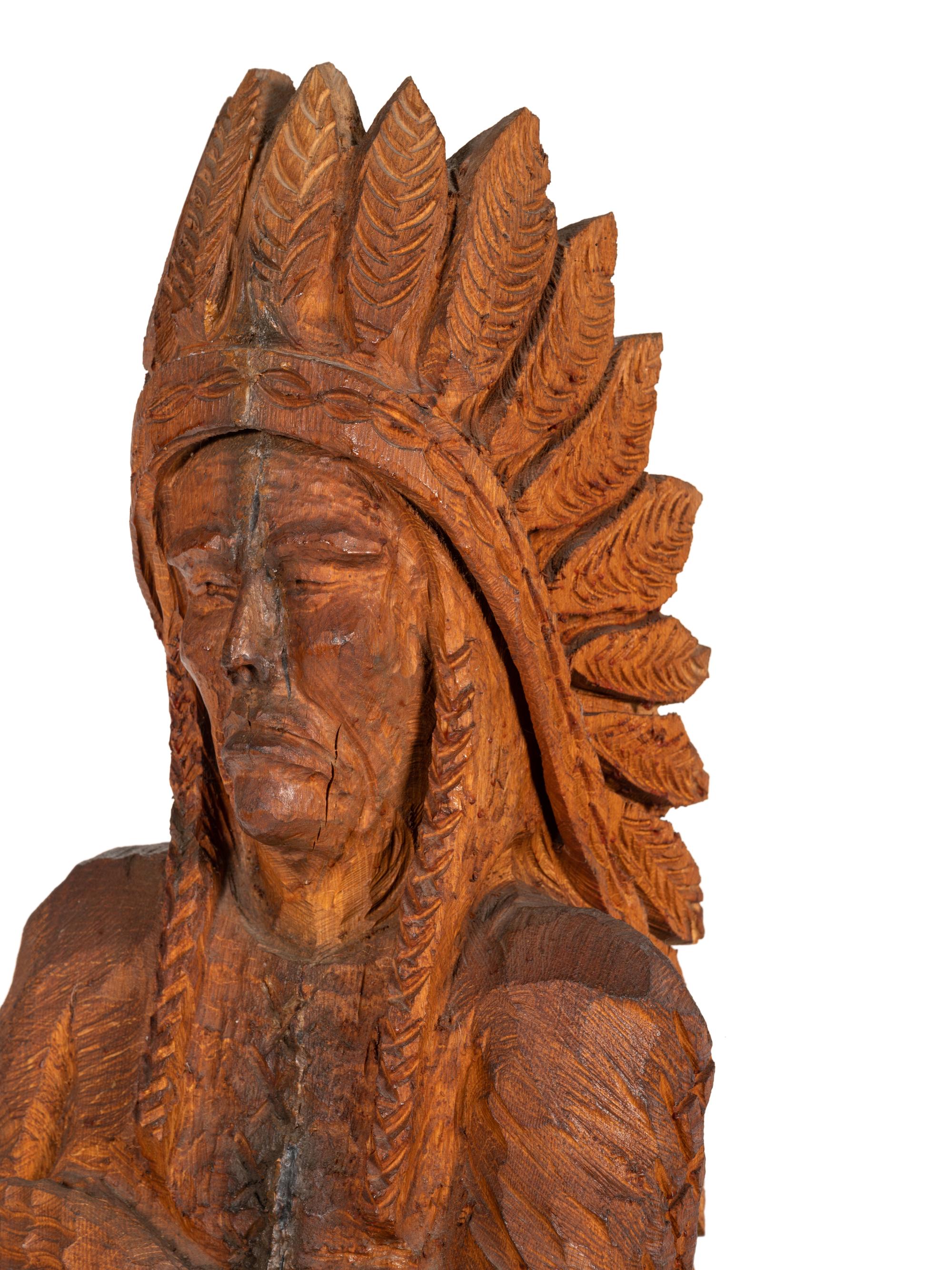 A Carved Wood Figure of an Indian by Don Colp (American, b. 1932)