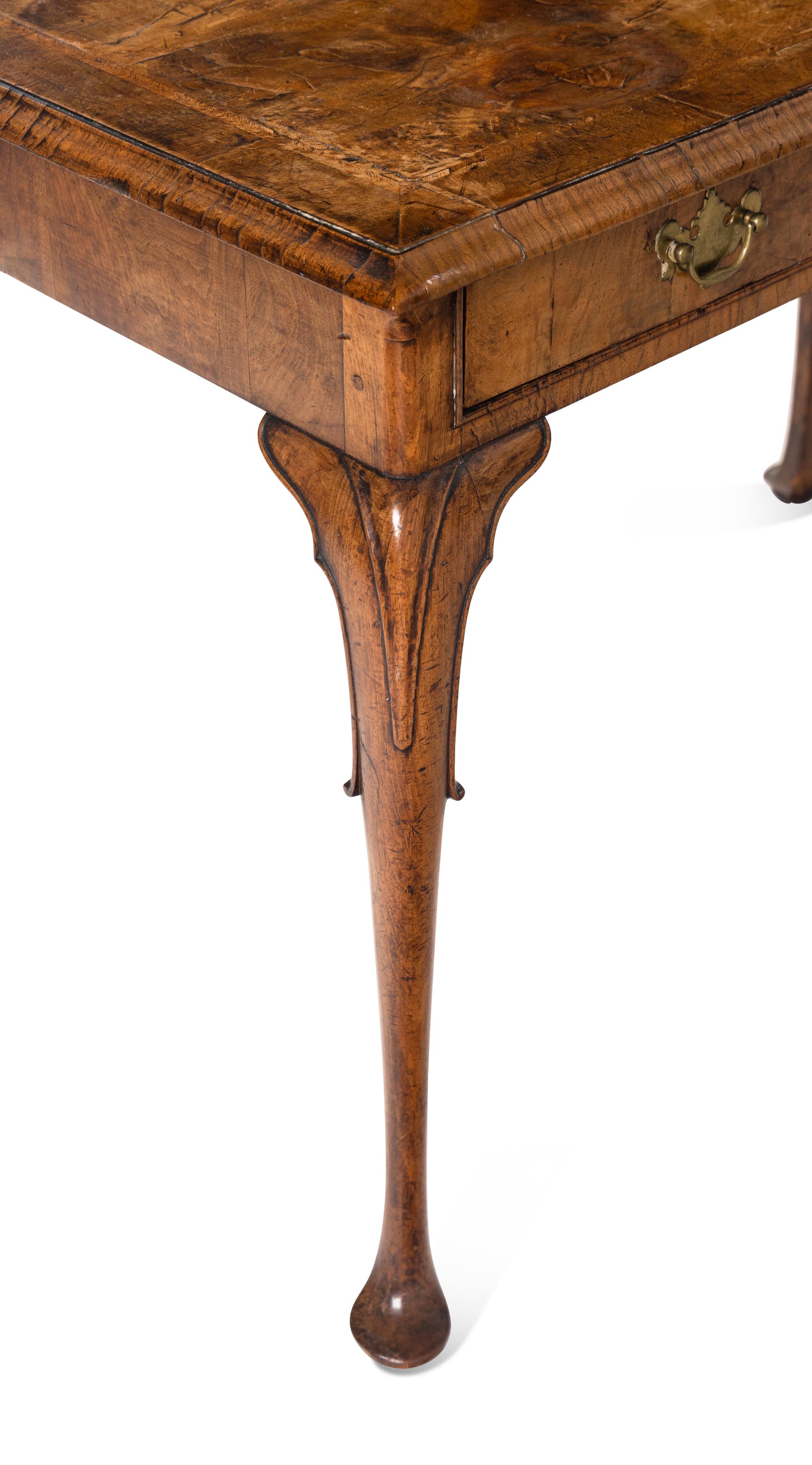 A George II Style Walnut Writing Table with an Associated Armchair
