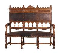 An Austrian Carved Walnut Bench with Tooled Leather Upholstery