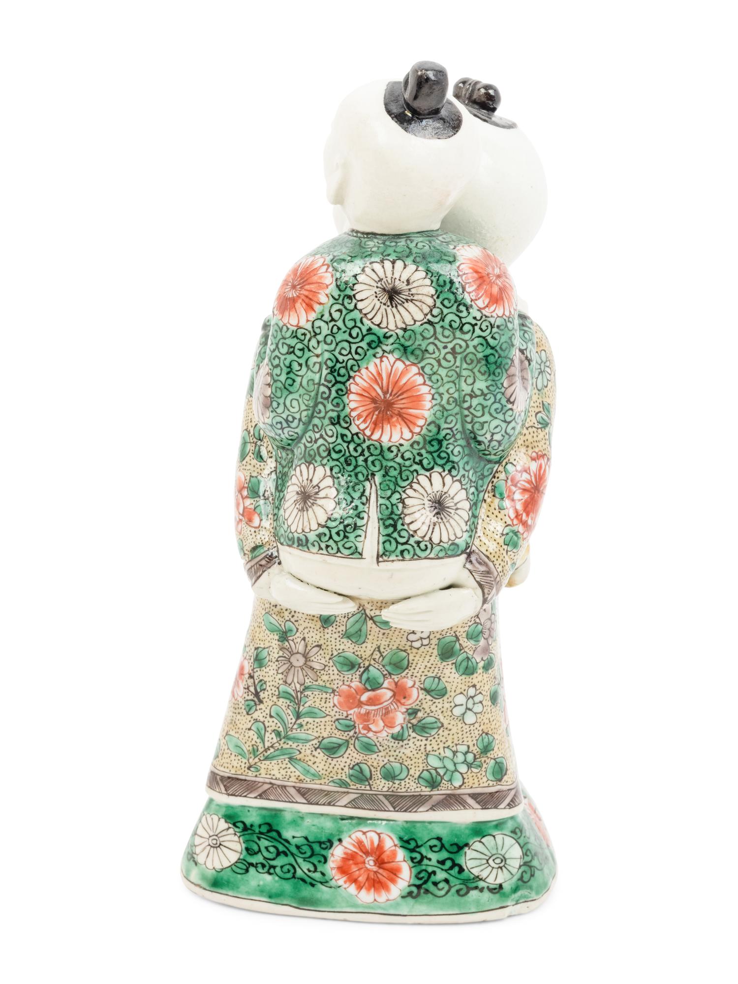 A Chinese Famille Verte Biscuit Porcelain 'Piggyback' Group