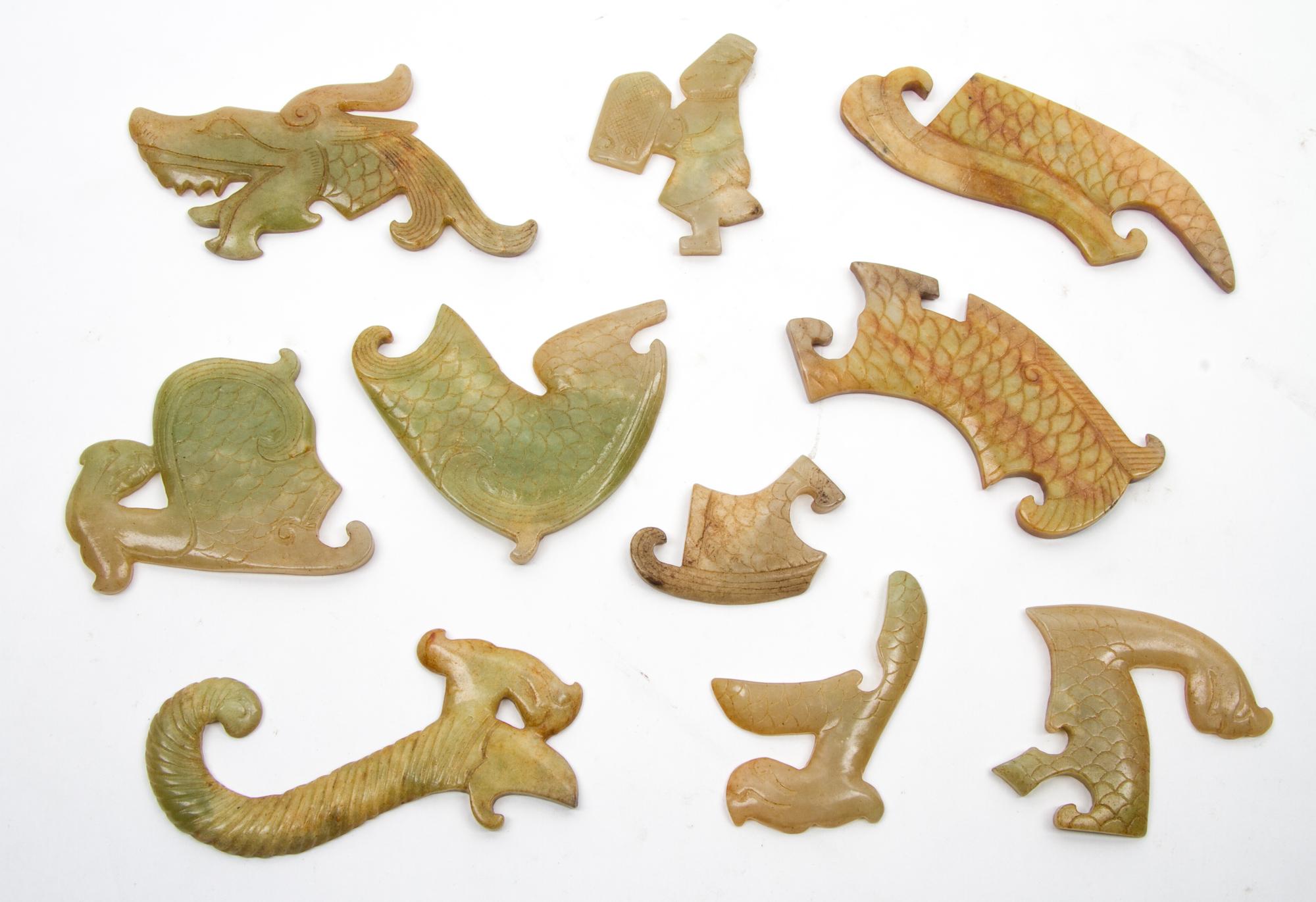 A Group of Ten Archaistic Jade Carvings Length of largest 4 1/2 inches.
