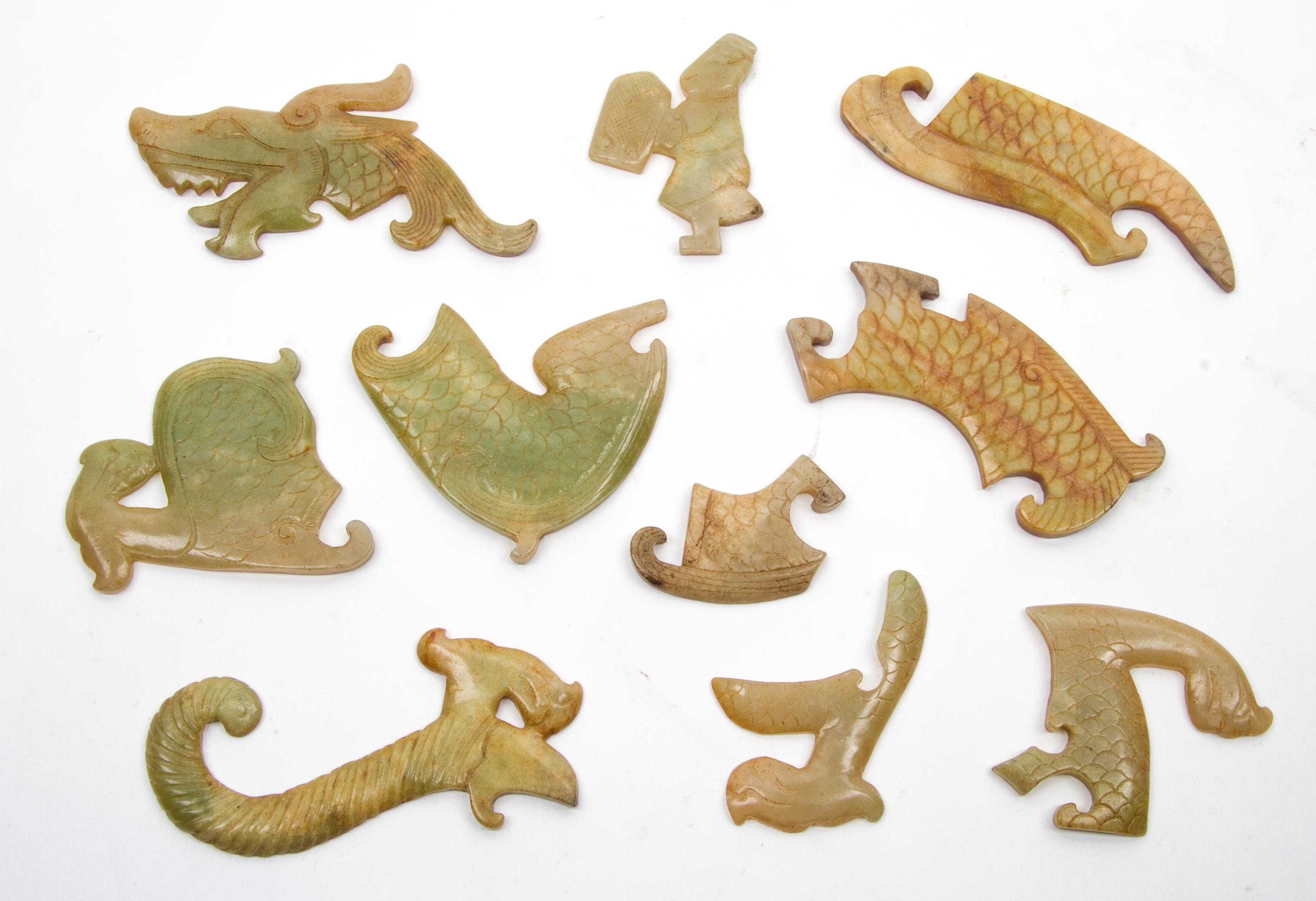 A Group of Ten Archaistic Jade Carvings Length of largest 4 1/2 inches.