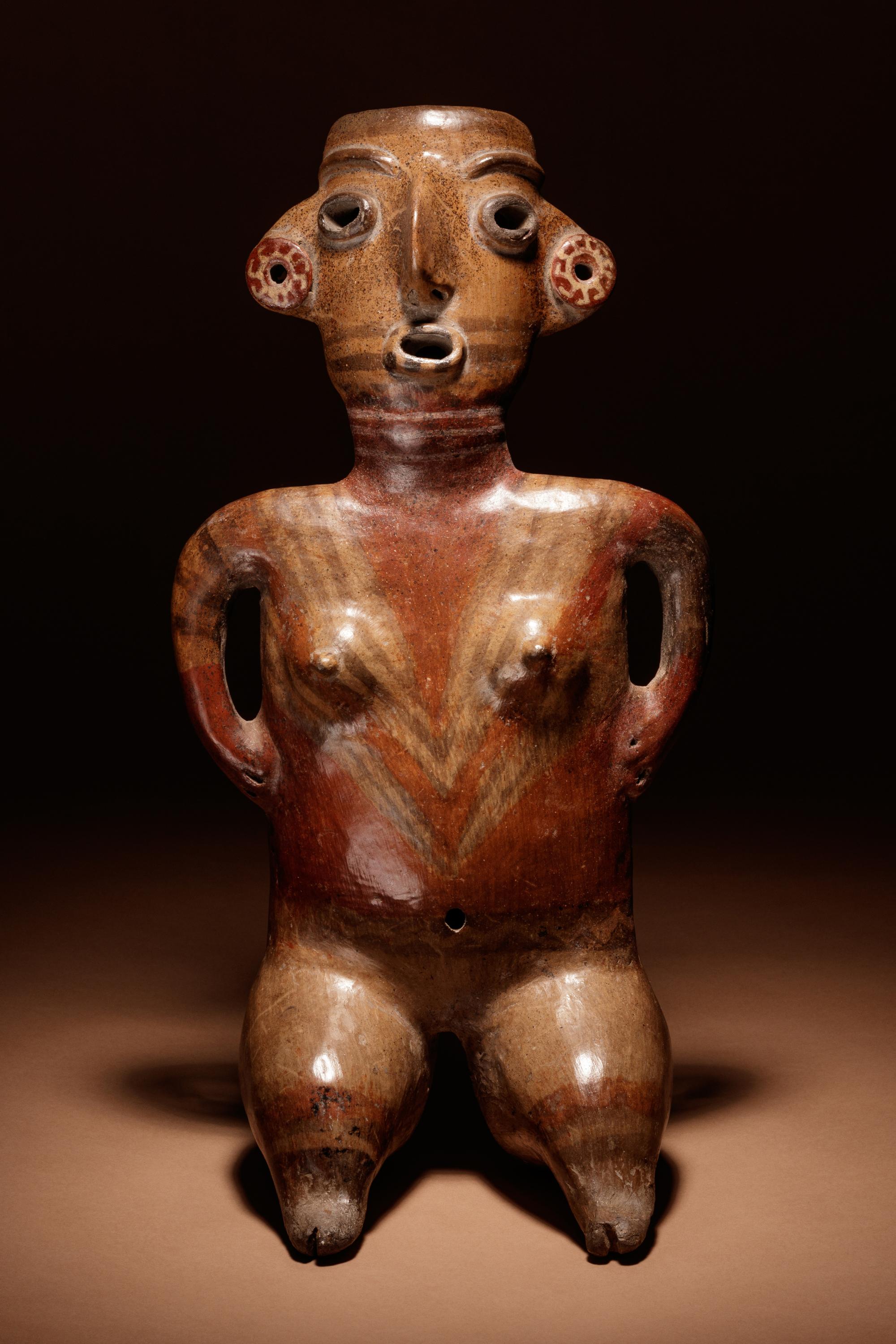 A Zacatecas Painted Terracotta Seated Female