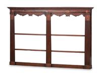 A Regency Inlaid and Carved Walnut Hanging Pewter Rack