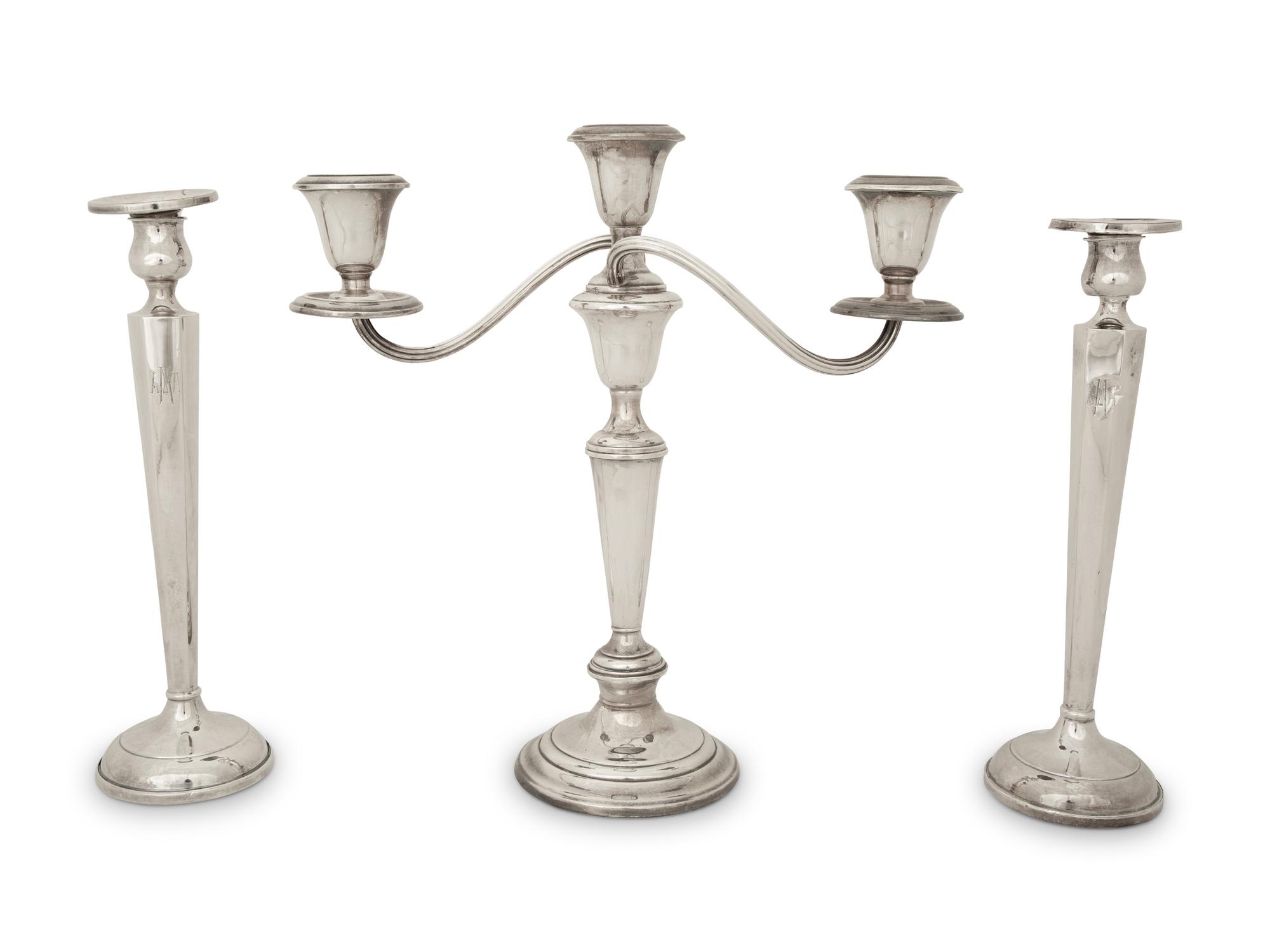 A Pair of American Silver Candlesticks and an American Silver Three Light Candelabrum