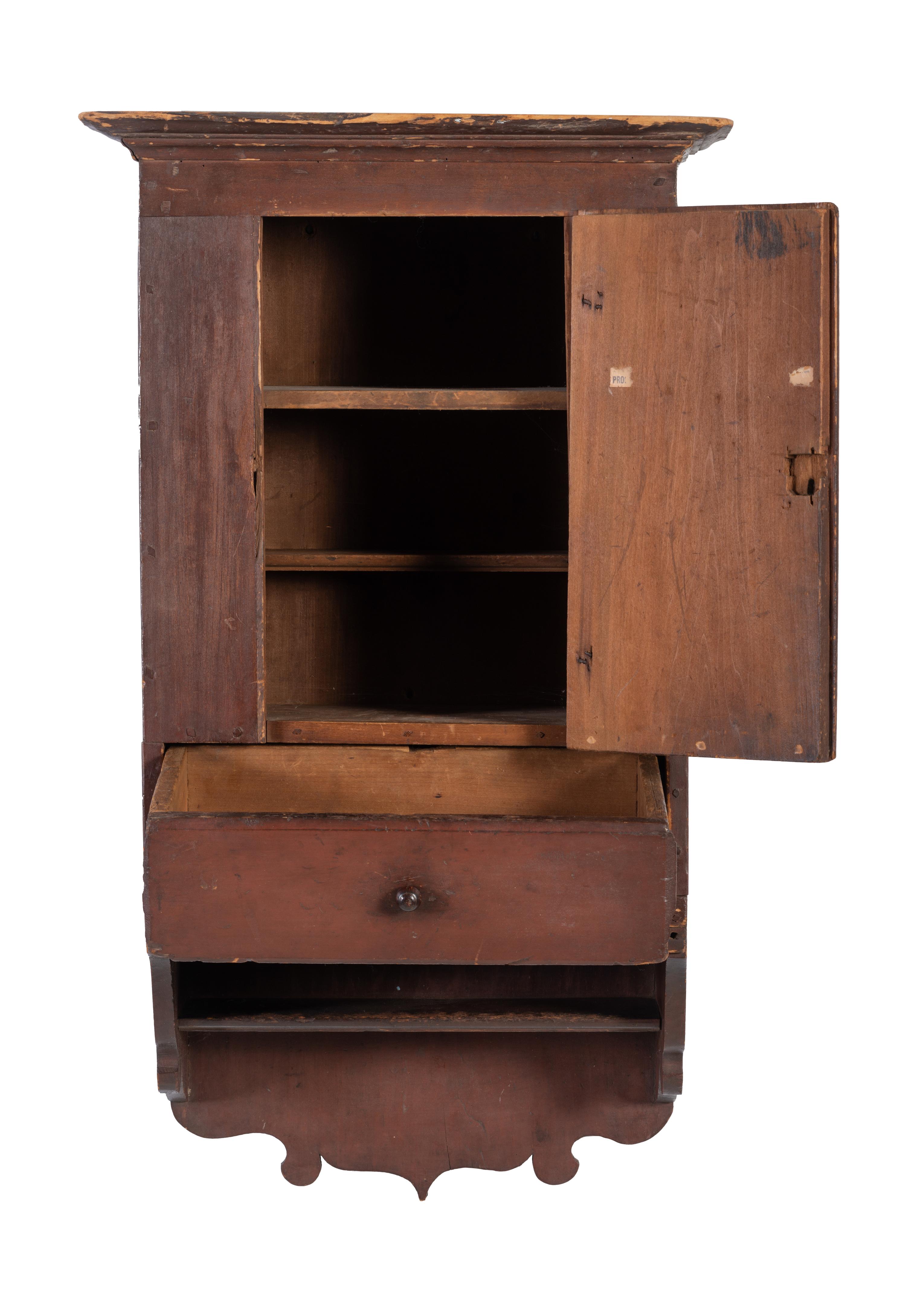A Country Red-Stained and Carved Cherrywood Hanging Wall Cupboard
