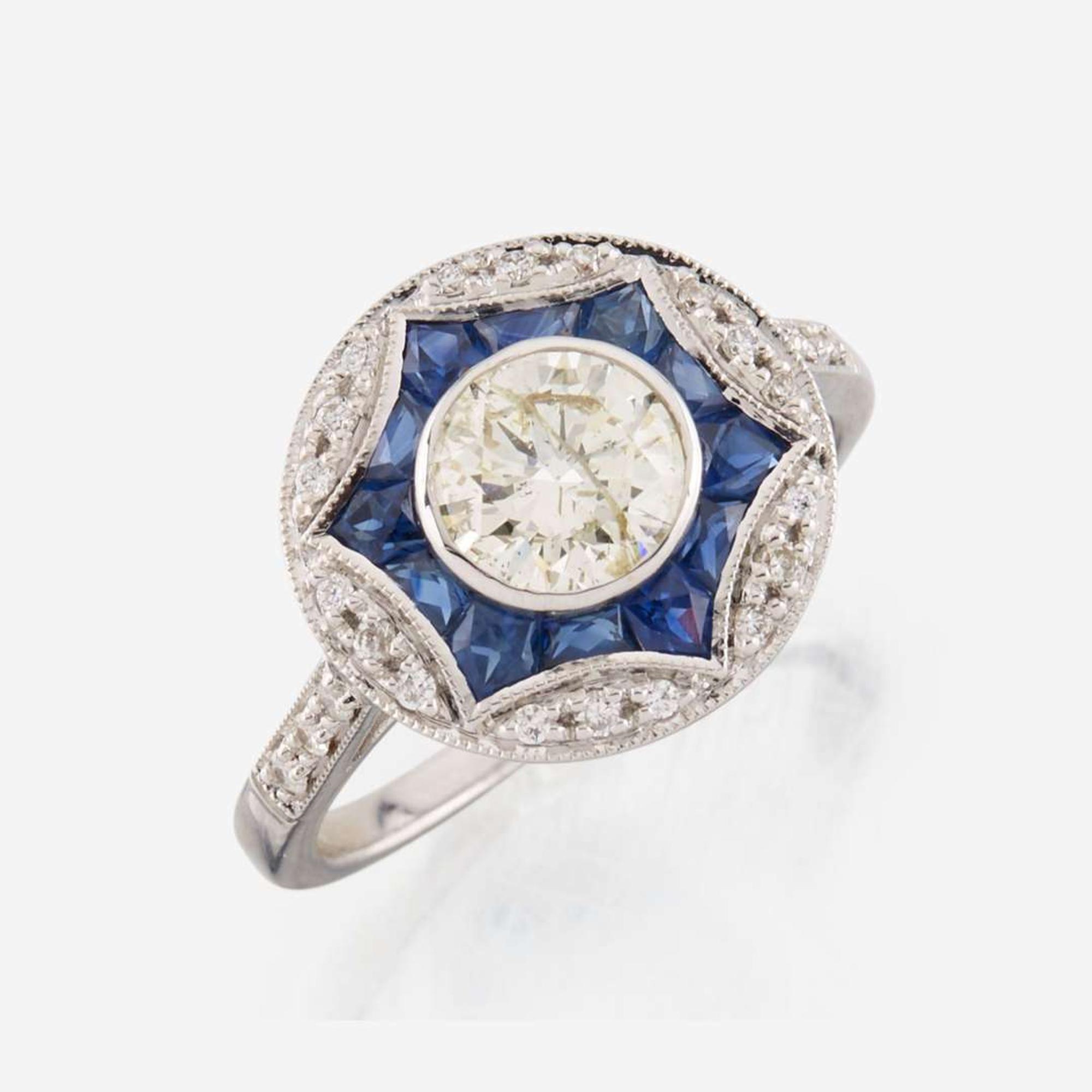 A diamond, sapphire, and white gold ring