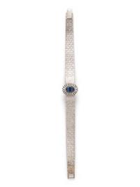PIAGET, 18K WHITE GOLD, DIAMOND AND SAPPHIRE SURPRISE WATCH