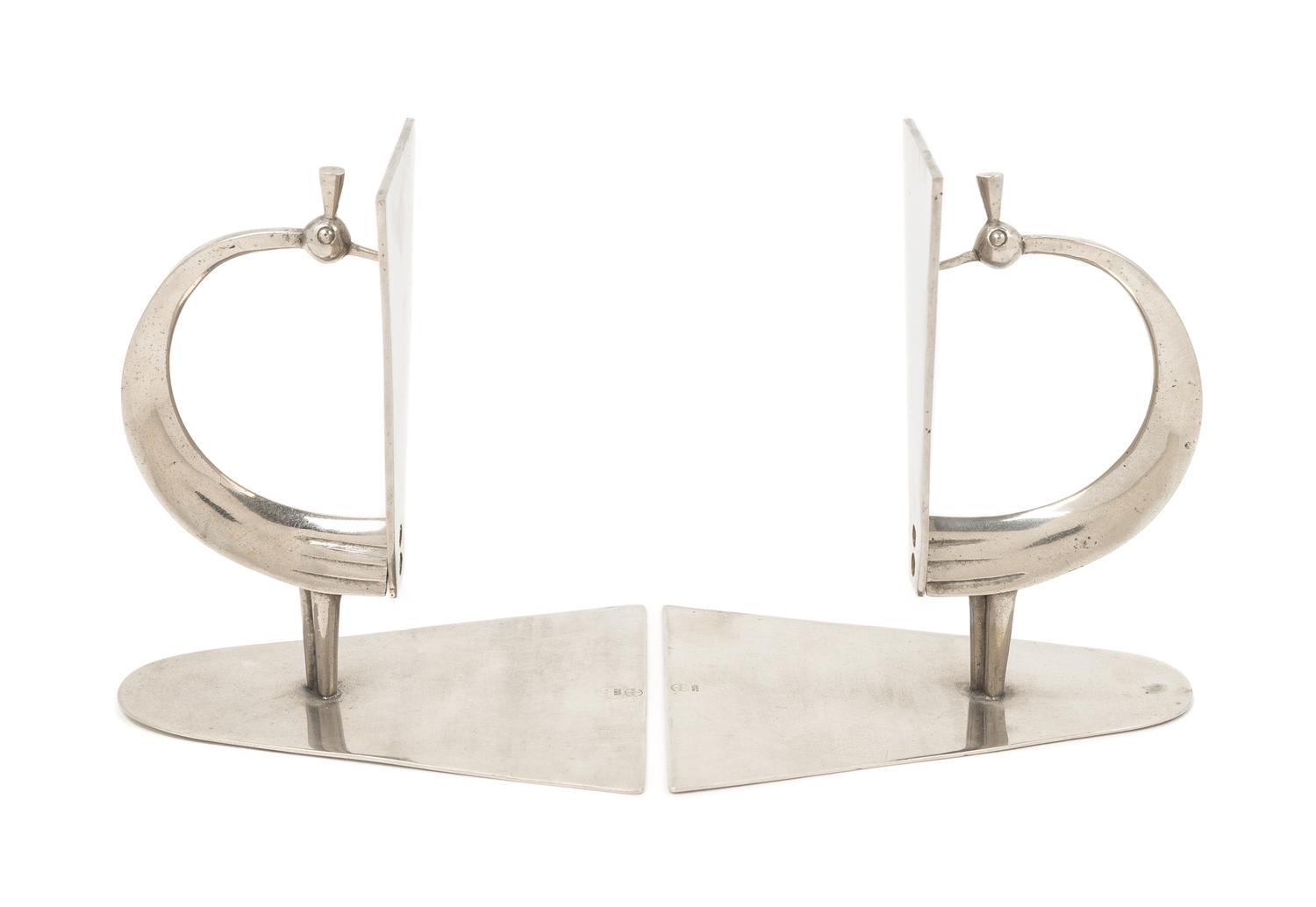Werkstätte Hagenauer Wien, Austria, FIRST HALF 20TH CENTURY, a pair of peacock form Art Deco book ends