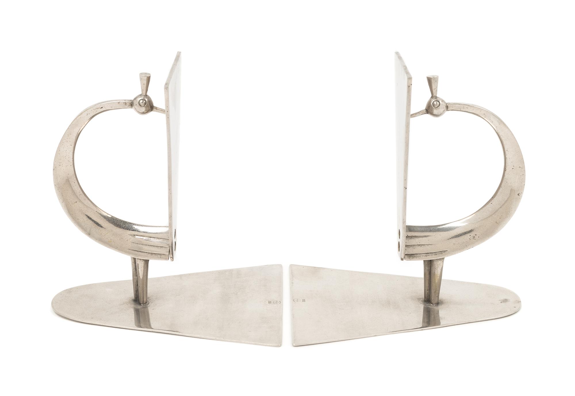 Werkstätte Hagenauer Wien, Austria, FIRST HALF 20TH CENTURY, a pair of peacock form Art Deco book ends