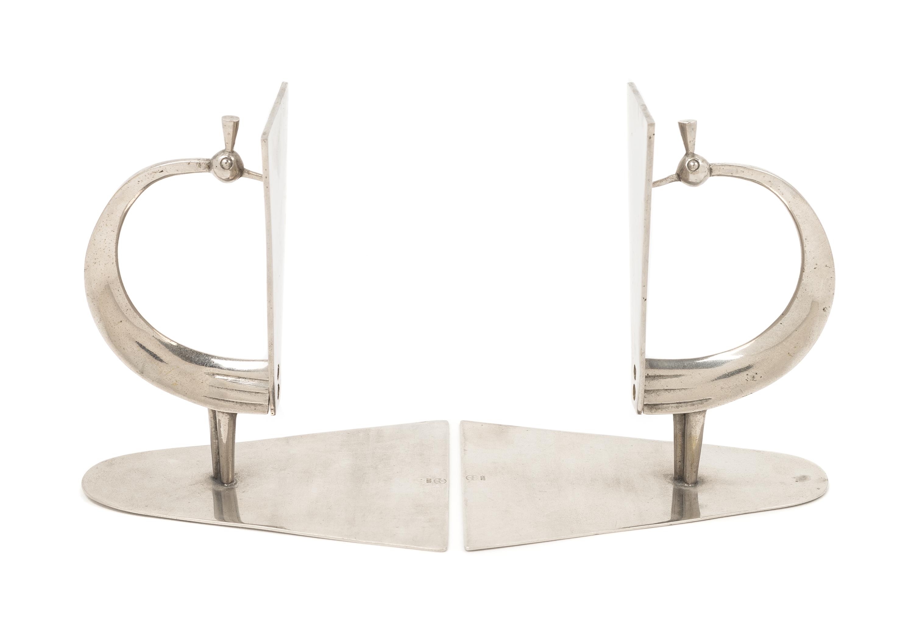 Werkstätte Hagenauer Wien, Austria, FIRST HALF 20TH CENTURY, a pair of peacock form Art Deco book ends