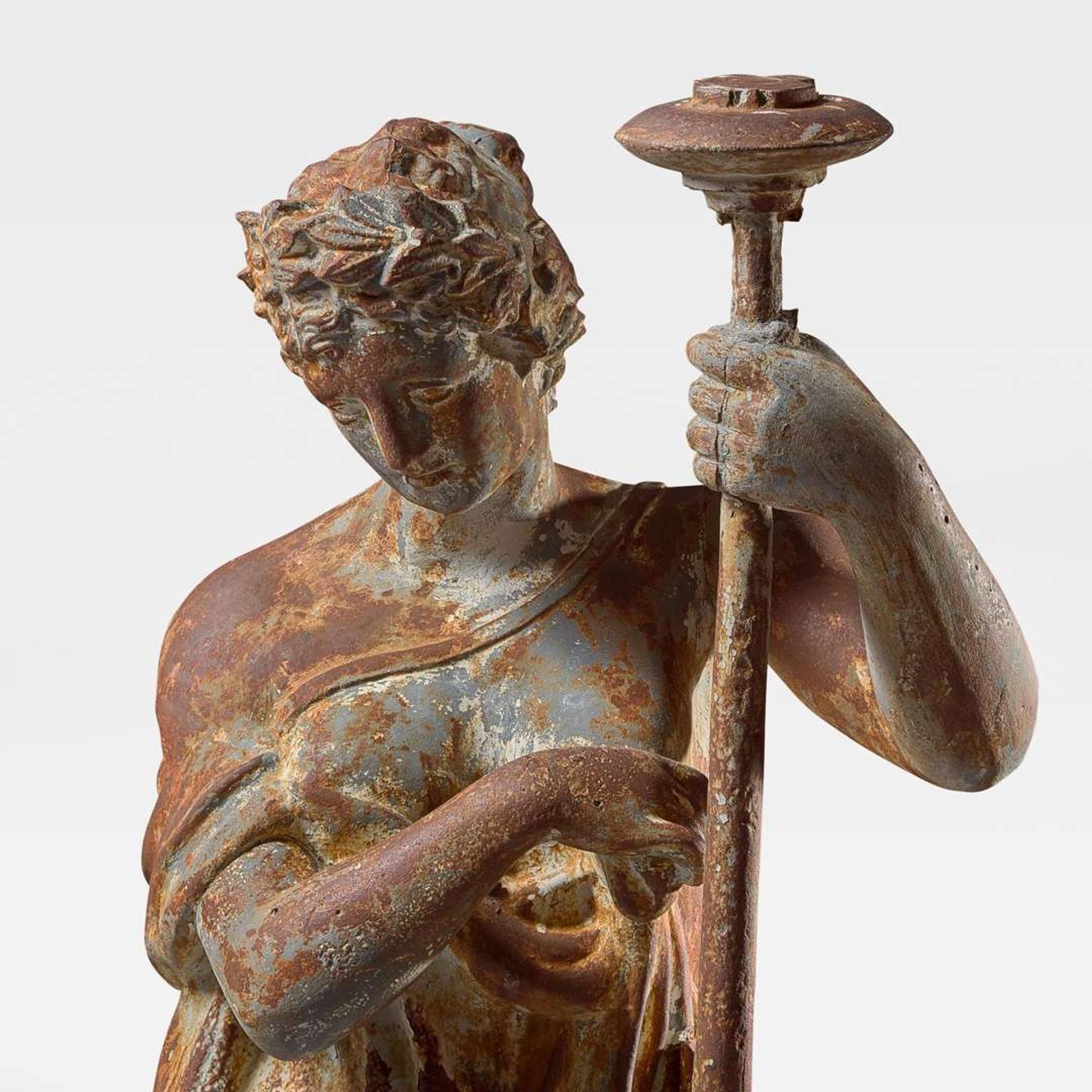 A cast iron garden figure of a Classical lady late 19th century