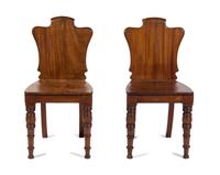 A Pair of William IV Style Mahogany Hall Chairs Height 33 inches.