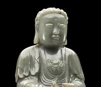 A Chinese Celadon Jade Figure of Medicine Buddha