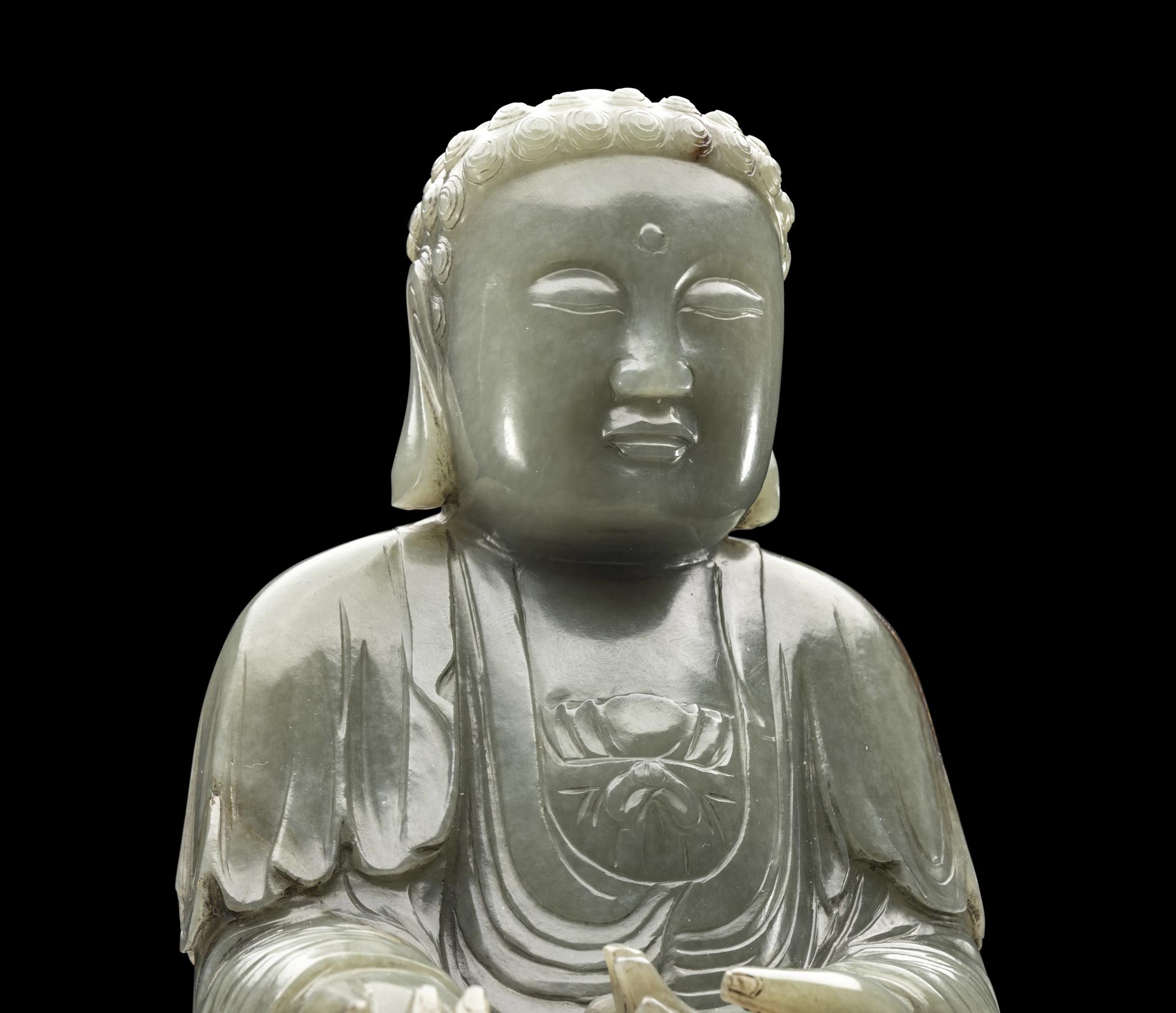A Chinese Celadon Jade Figure of Medicine Buddha