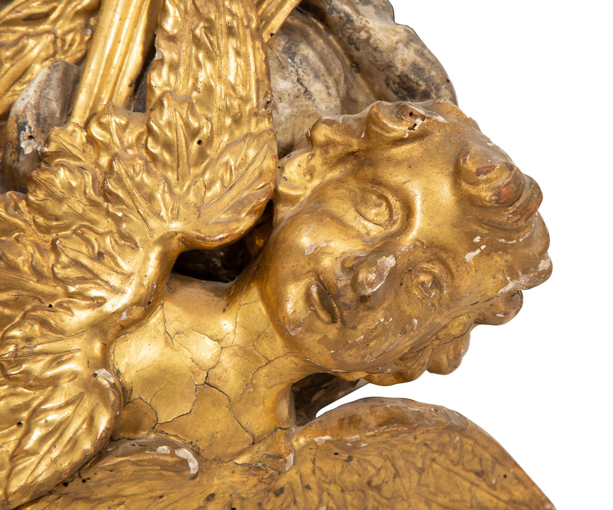 An Italian Carved Giltwood and Silvered Wall Mount
