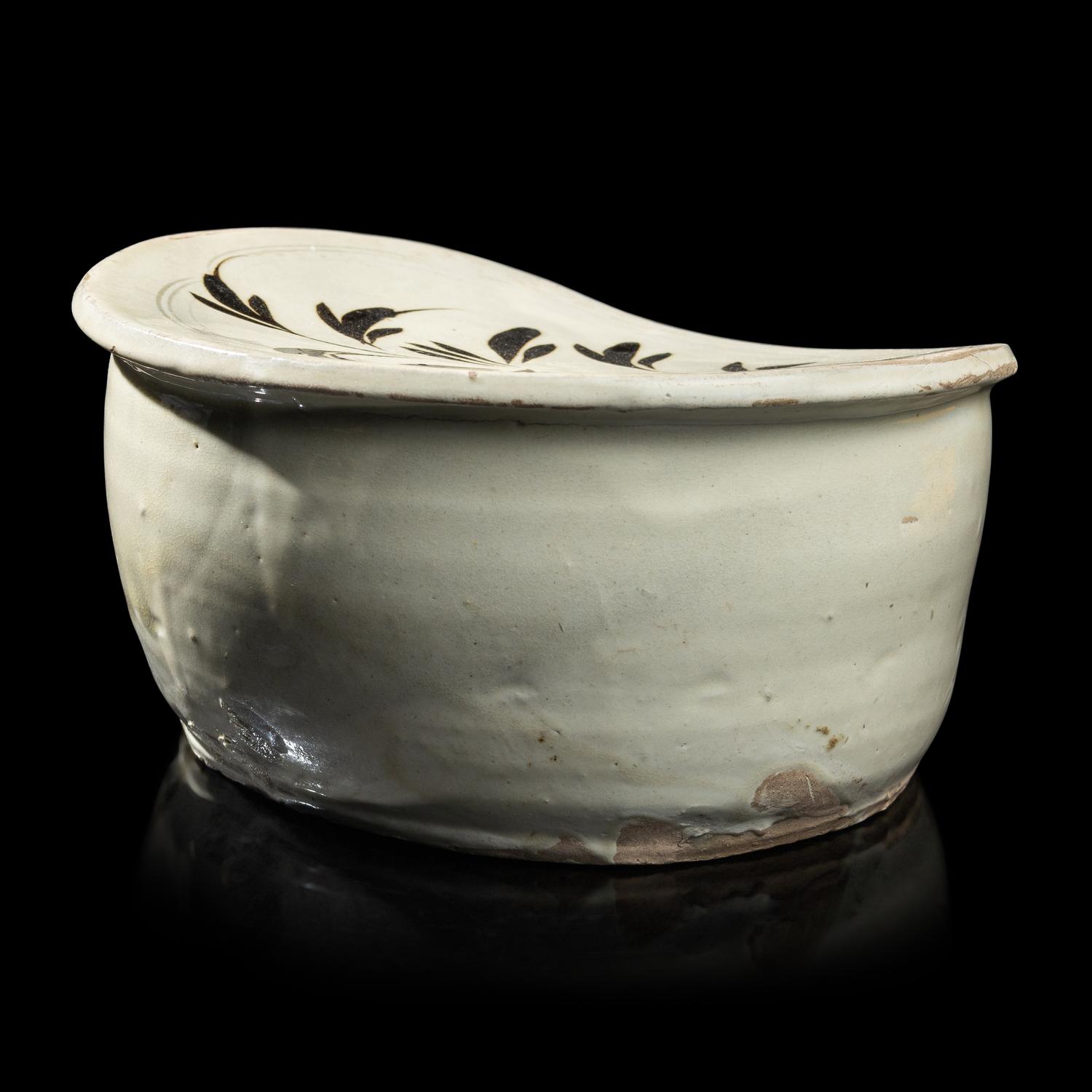 A Chinese Cizhou- Type White Glazed 'Floral' Porcelain Pillow, Yuan Dynasty 元 磁州窯白釉花卉紋枕