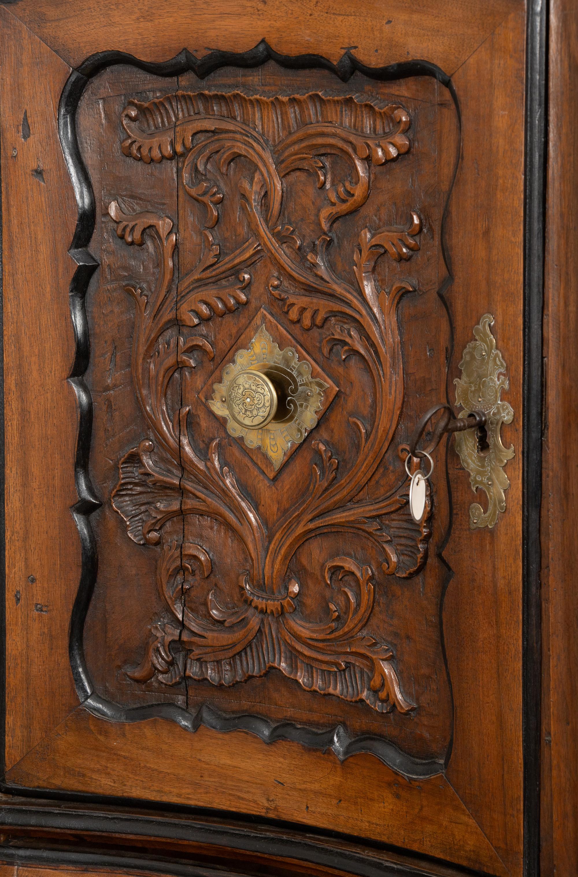 A Portuguese Carved Walnut Parcel Ebonized Bureau Cabinet on Chest