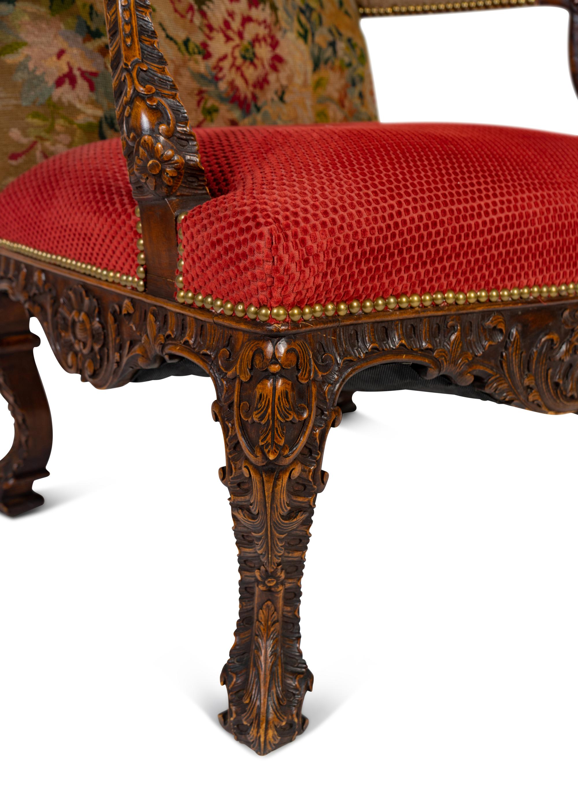 A Régence Style Carved Walnut Bergère à Oreilles with Petit Point Upholstery