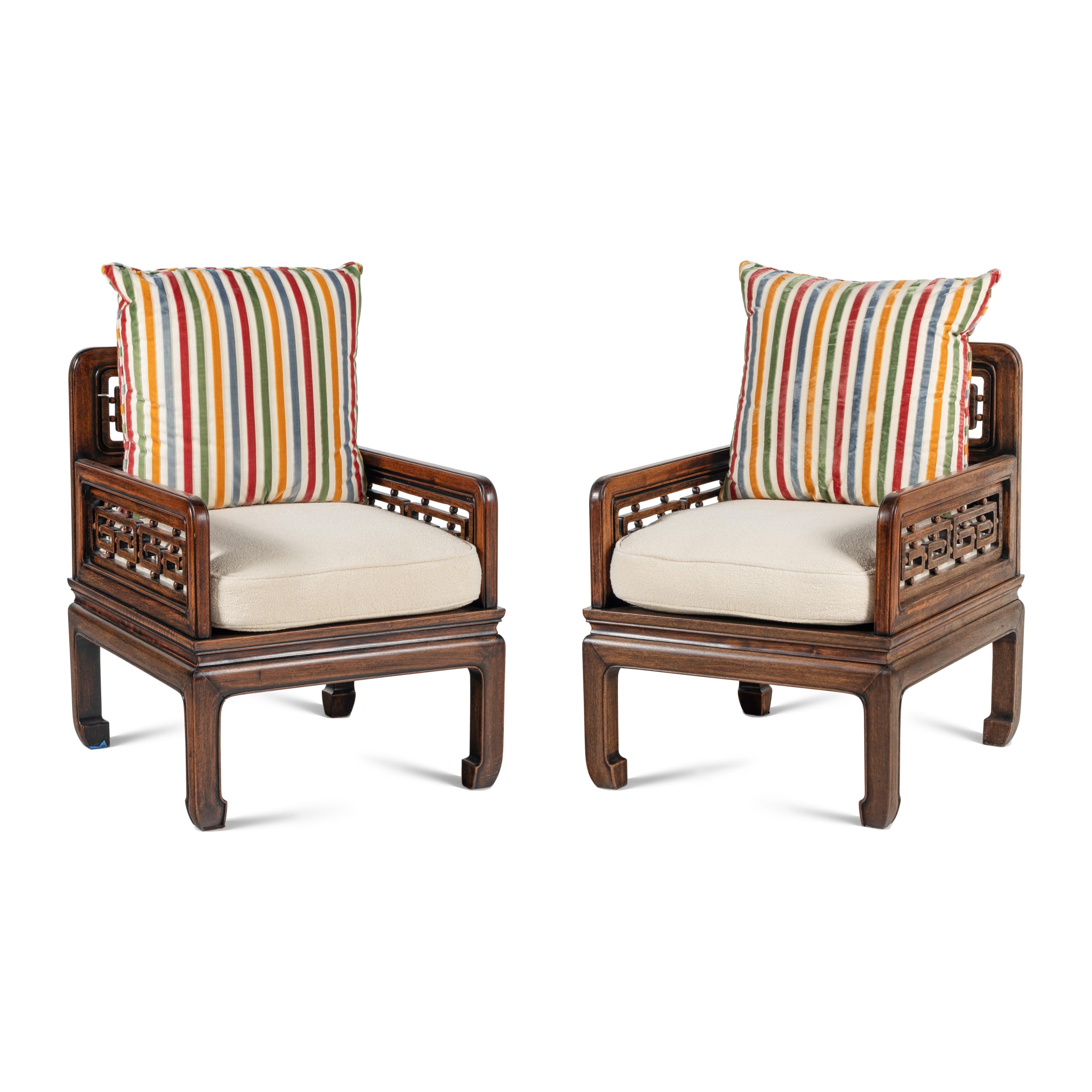 A Pair of Indonesian Carved Hardwood Armchairs