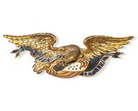 A Carved and Painted Giltwood Eagle