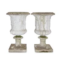 A Pair of Neoclassical Style Cast Stone Jardinières on Plinths