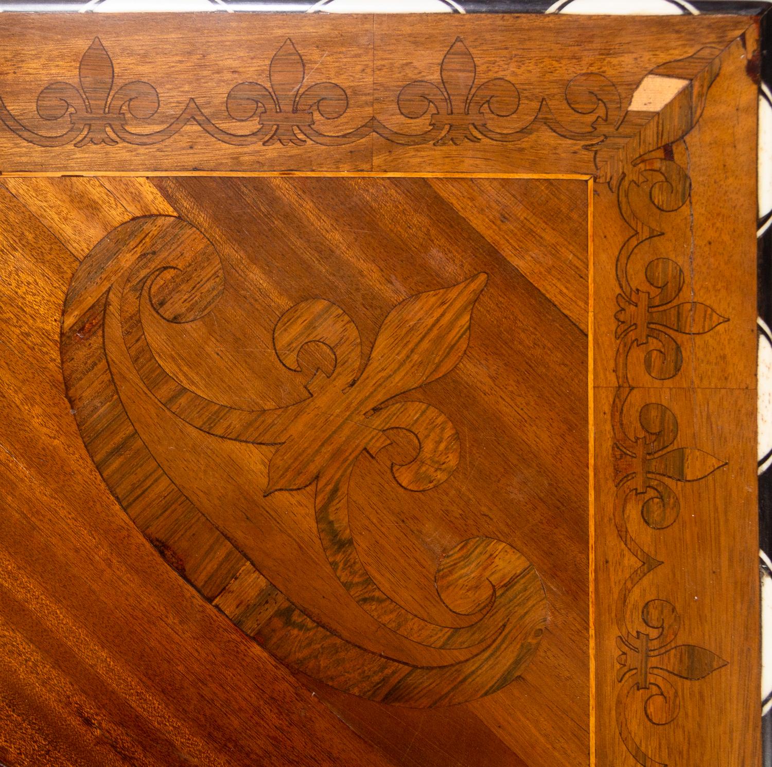 A Northern Italian Bone Inlaid Marquetry, Walnut and Ebony Center Table