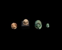 Four Egyptian Faience and Jasper Hedgehog Scaraboids