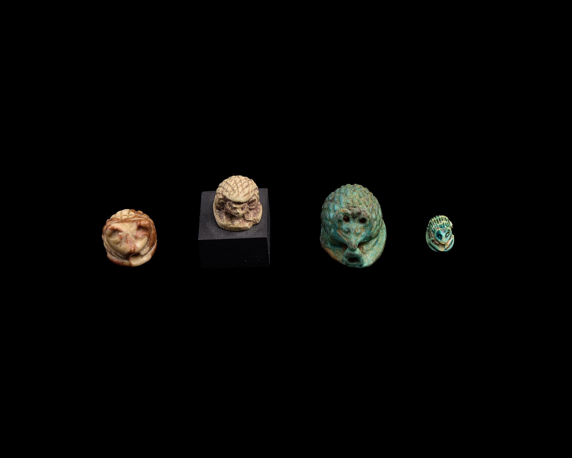 Four Egyptian Faience and Jasper Hedgehog Scaraboids