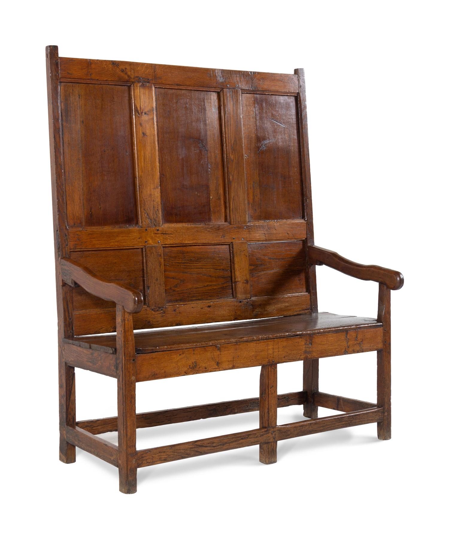 A Jacobean Molded and Paneled Oak Settle