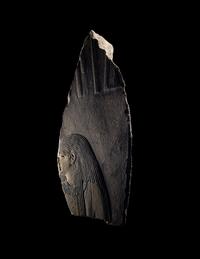 An Egyptian Painted Limestone Relief Fragment