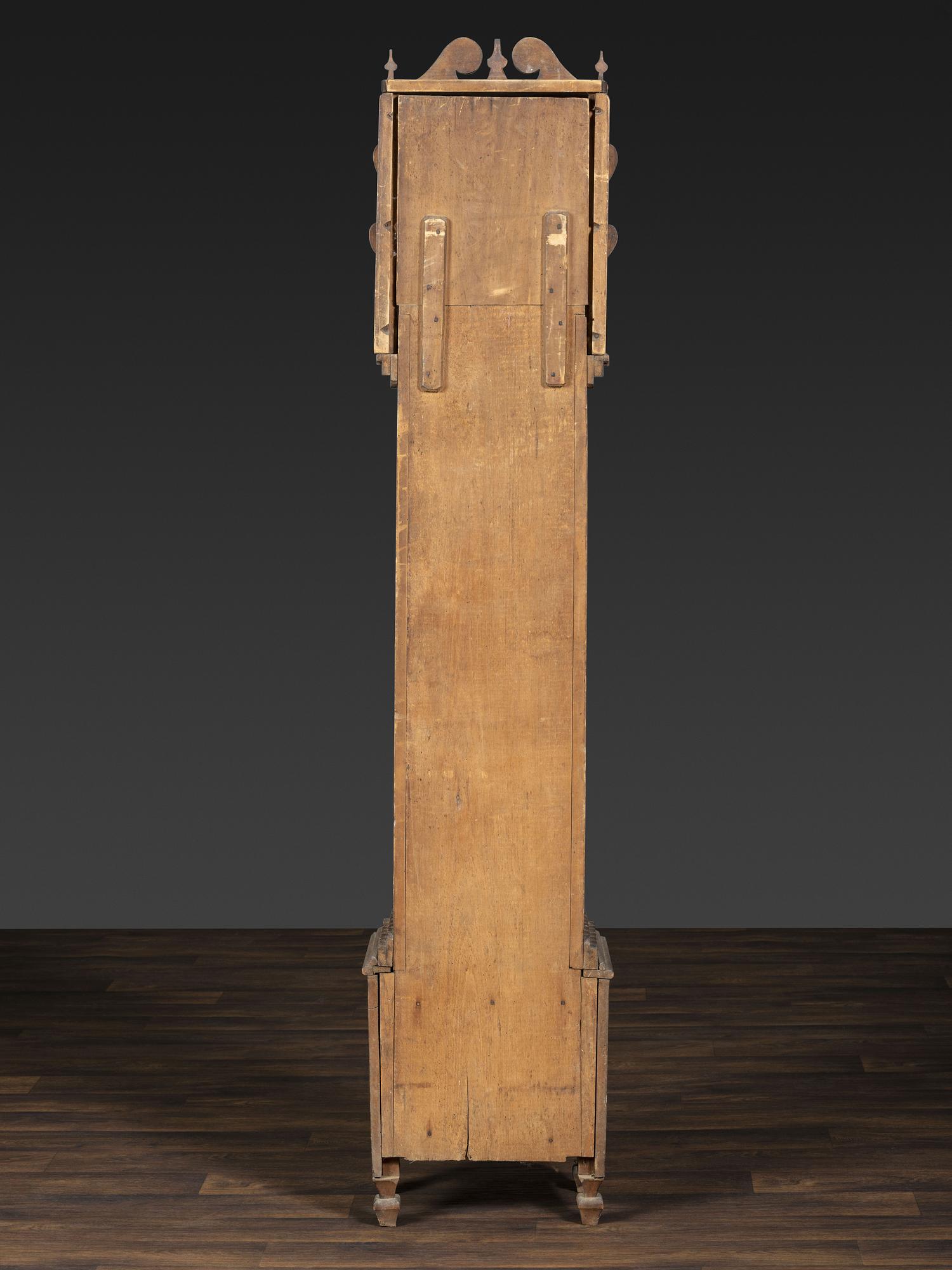 A Folk Art Carved Maple Clock Case
