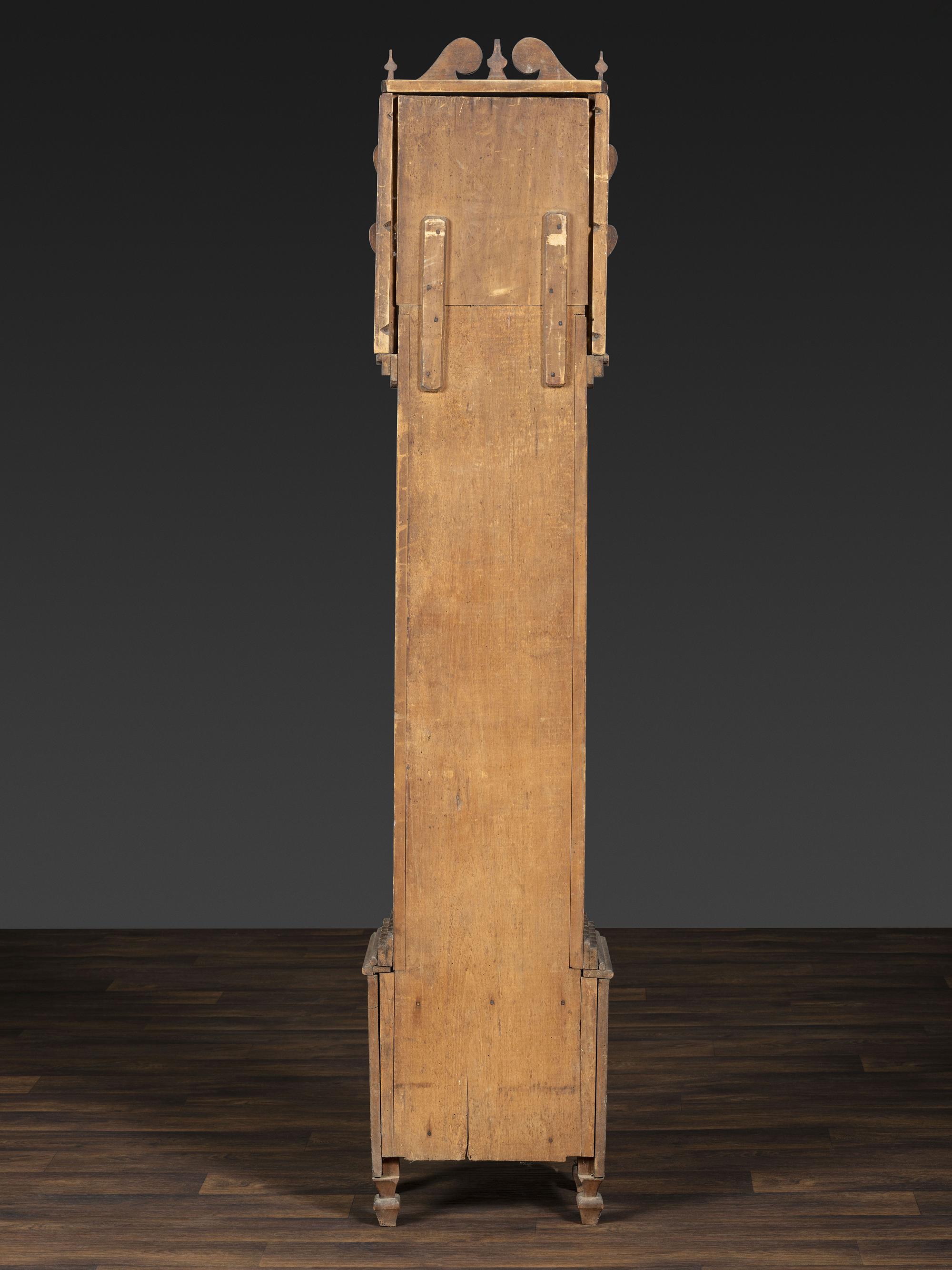 A Folk Art Carved Maple Clock Case